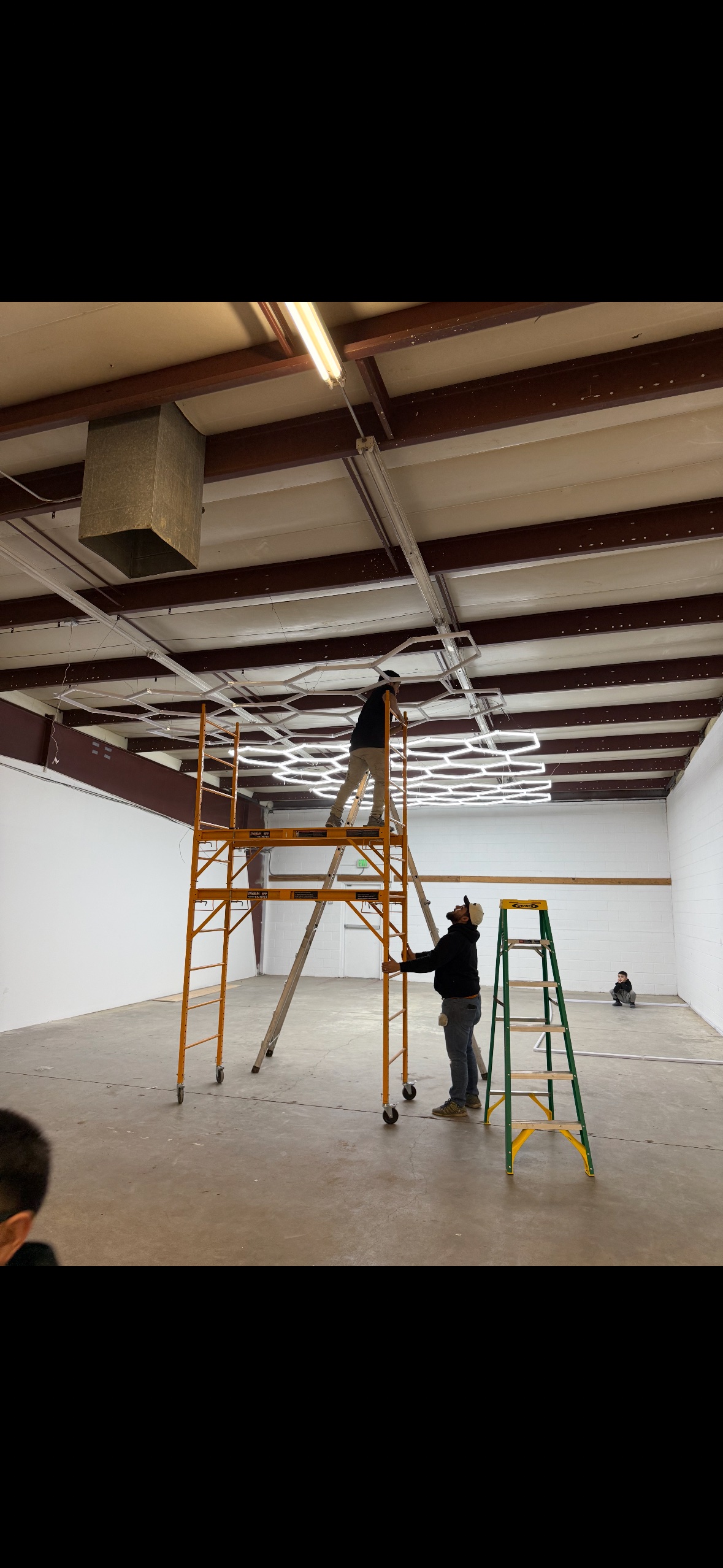 Warehouse LED lighting installation in progress